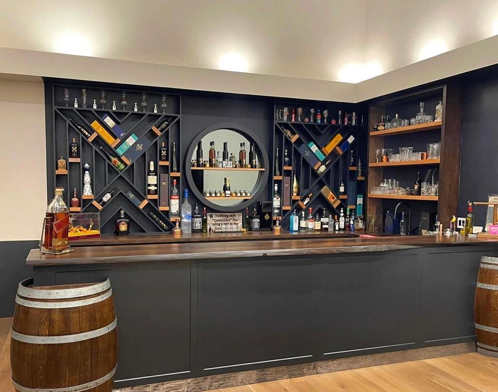 Custom finished basement bar and entertainment space